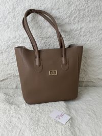 Brown leather university bag from Daisy Store on textured background.
