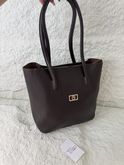 Brown leather university bag with handles, Daisy Store tag visible.