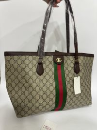 Gucci Ophidia GG Tote with iconic monogram and green-red stripe design.