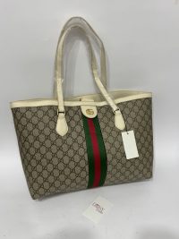 Gucci Ophidia GG Tote with iconic monogram and green-red stripe design.