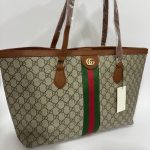 Gucci Ophidia GG Tote with iconic monogram and stripe design.