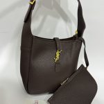 Black leather tote bag with gold accents, Daisy Store.