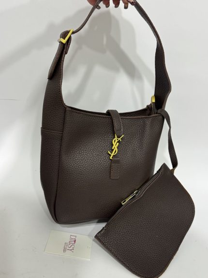 Black leather tote bag with gold accents, Daisy Store.
