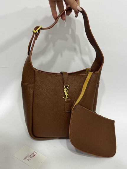 Brown structured handbag with scarf and gold accents.
