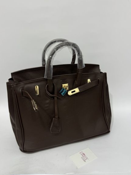 Elegant brown university bucket bag with gold accents.