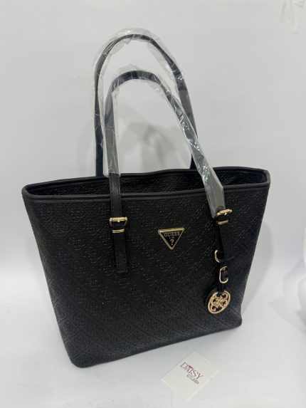 Black Michael Kors tote bag with embossed pattern and gold accents.