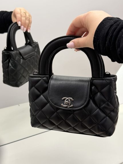 Black quilted Chanel mini handbag with elegant design.