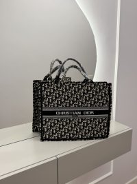 Christian Dior Book Tote, elegant women's handbag on display.