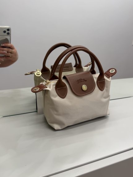 Çanta Longchamp Le Pliage Small, elegant beige tote with brown leather accents.