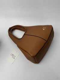 Brown Coach Tote Bag with gold logo on white background.