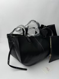 Polene black tote bag with small pouch on display.