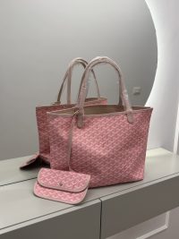 Pink Goyard Saint Louis Tote with pouch on mirrored surface.