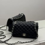 Black Chanel Classic Flap bag with quilted leather and chain strap.