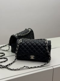Black Chanel Classic Flap bag with quilted leather and chain strap.
