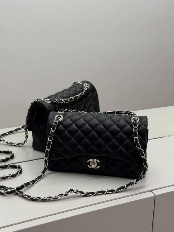 Black Chanel Classic Flap bag with quilted leather and chain strap.