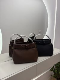 Çanta bucket bags with studded straps on display.