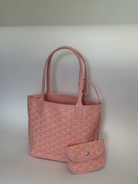 Pink Goyard Anjou Tote Bag with matching pouch on white background.