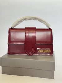 Mini Jacquemus Le Bambino bag, elegant burgundy leather design.