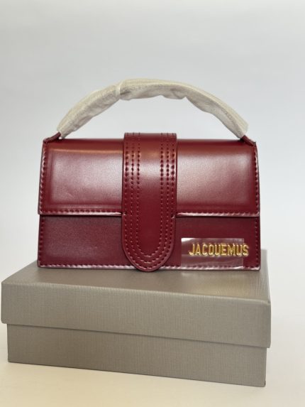 Mini Jacquemus Le Bambino bag, elegant burgundy leather design.