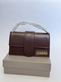 Brown Jacquemus Le Bambino mini bag on a gray box.
