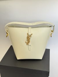 Elegant YSL bucket bag with gold accents for women.