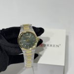 Curren Ora Dial Jeshile Ari watch with green dial and gold accents.