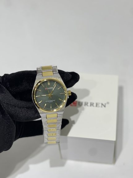 Curren Ora Dial Jeshile Ari watch with green dial and gold accents.