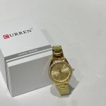 Gold Curren Ora Femrash watch with crystals and box.