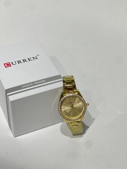 Gold Curren Ora Femrash watch with crystals and box.
