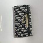 Elegant Dior women's wallet with monogram pattern.