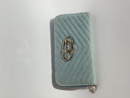 Elegant blue Diesel women's wallet with chevron pattern and logo.