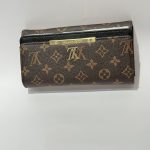 Louis Vuitton women's wallet, elegant monogram design, brown leather.