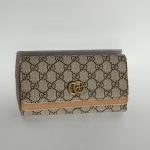 Stylish women's Diesel wallet with patterned design and gold logo.
