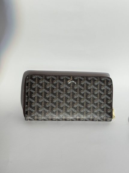 Elegant Goyard women's wallet with signature pattern design.