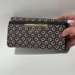 Gucci Portofol Femrash wallet with elegant monogram design and gold accents.
