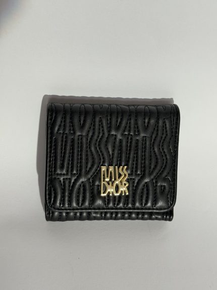 Black embossed women's wallet with gold logo detailing.