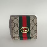 Gucci Portofol Femrash wallet with iconic pattern and logo.
