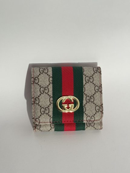 Gucci Portofol Femrash wallet with iconic pattern and logo.