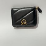 Elegant black women's wallet with gold emblem.