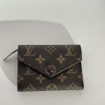 Luxury Louis Vuitton women's wallet with monogram design.