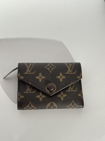 Luxury Louis Vuitton women's wallet with monogram design.