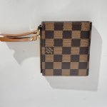Checkered brown wallet with wrist strap, elegant and stylish design.