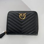 Black leather wallet with gold emblem, chevron pattern.