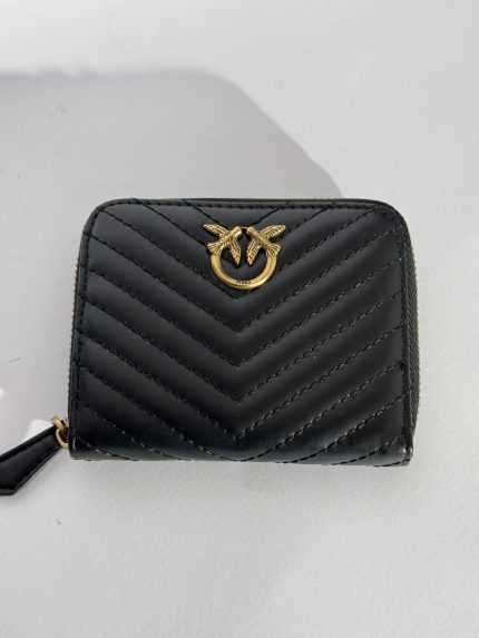 Black leather wallet with gold emblem, chevron pattern.