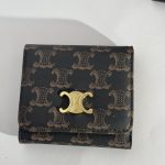 Elegant Louis Vuitton women's wallet with monogram pattern and gold clasp.