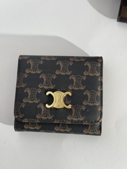 Elegant Louis Vuitton women's wallet with monogram pattern and gold clasp.