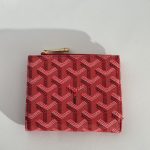 Red Goyard women's wallet with elegant pattern design.