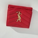 Red Goyard wallet with gold logo, elegant design.