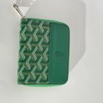 Green Goyard women's wallet with elegant pattern design.