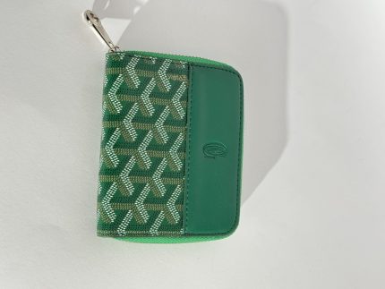 Green Goyard women's wallet with elegant pattern design.